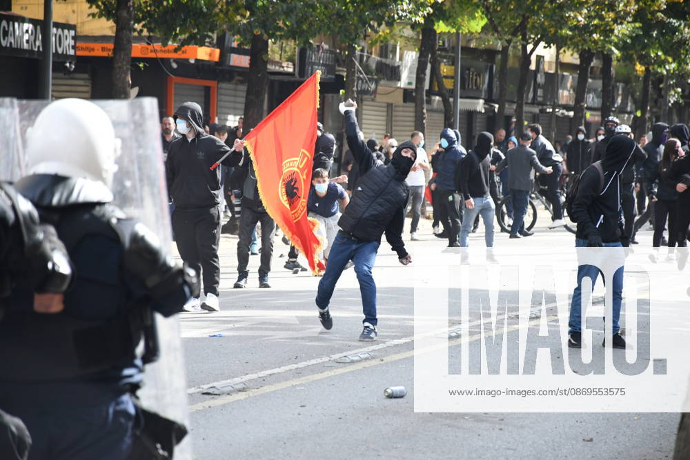 Student protests demanding improved educational conditions continue in Albania TIRANA, ALBANIA - OCTOBER 15: A masked protester throws an object toward riot police as demonstrators clash with security forces during the third day of protests demanding improved educational conditions in Tirana, Albania, on October 15, 2026. University students are joined by high school students and local residents as police use tear gas to disperse demonstrators outside the Ministry of Education and the Parliament building, while protesters throw stones and other objects at police officers. Olsi Shehu Anadolu Tirana Albania. Editorial use only. Please get in touch for any other usage.