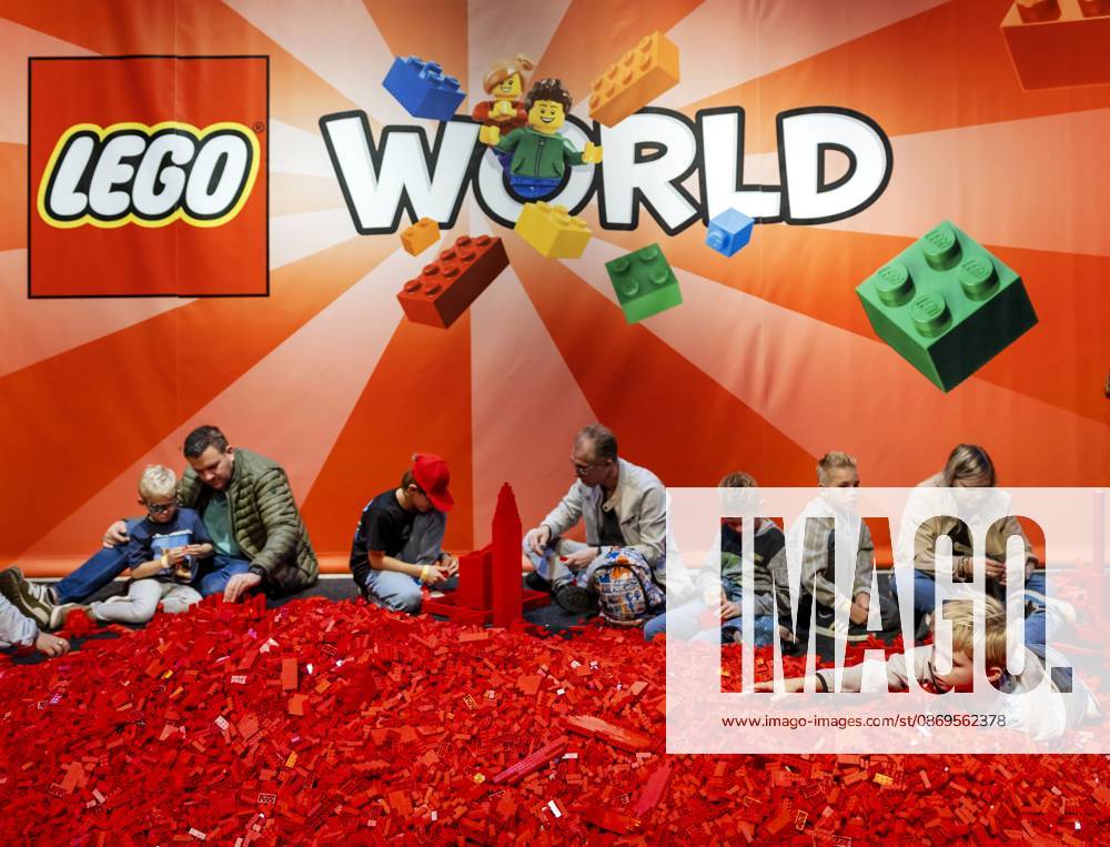 UTRECHT - Visitors build with LEGO during the first day of LEGO World at the Jaarbeurs. For seven days, young and old can let loose with the building toys. REMKO DE WAAL ANP netherlands out - belgium out