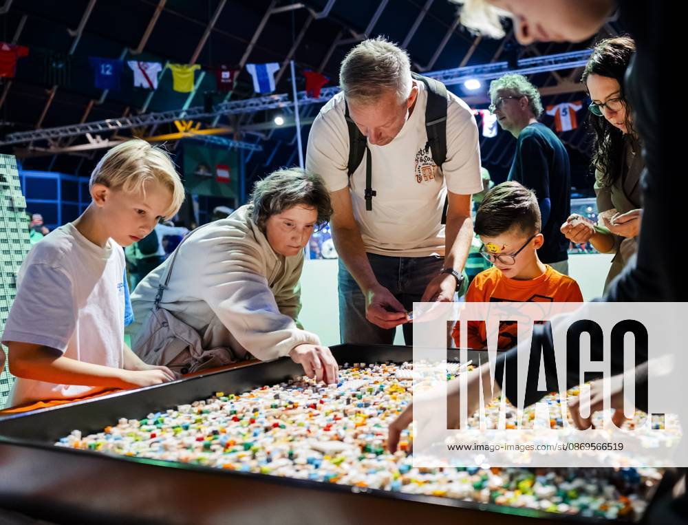 UTRECHT - Visitors build with LEGO during the first day of LEGO World at the Jaarbeurs. For seven days, young and old can let loose with the building toys. REMKO DE WAAL ANP netherlands out - belgium out