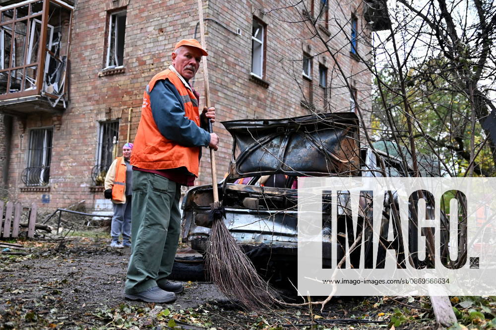 Aftermath Of A Russian Drone Attack In Kyiv, 15 Oct 2026 A municipal worker stands in front of a damaged residential building in Kyiv, Ukraine, on October 15, 2026, following an explosion caused by a Geran-5 jet-powered drone. Kyiv Ukraine