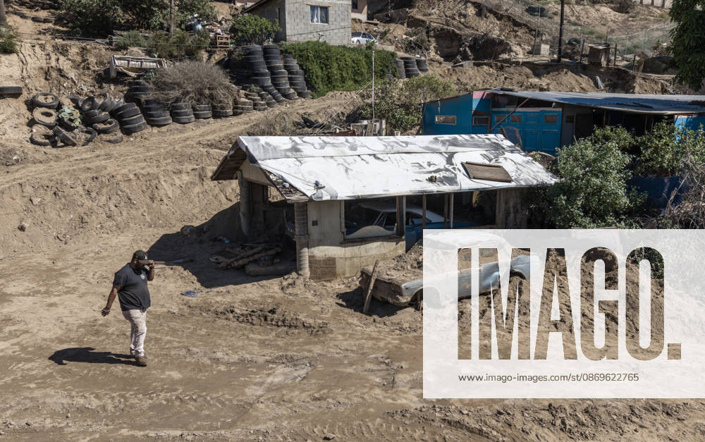 Tropical Storm Rachel leaves deadly flooding and damage in Ensen ENSENADA, MEXICO - OCTOBER 15: Homes and vehicles in the San Fernando community of Maneadero remain buried under a sand landslide triggered by Tropical Storm Rachel in Ensenada, Baja California, Mexico, on October 15, 2026. As local residents initiate cleanup and recovery efforts, authorities confirmed that the storm has claimed at least nine lives, with search operations still ongoing for one missing person. Omar Martinez Anadolu Ensenada Mexico. Editorial use only. Please get in touch for any other usage.