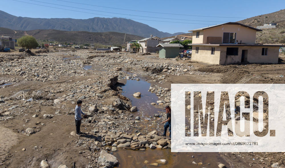 Tropical Storm Rachel leaves deadly flooding and damage in Ensen ENSENADA, MEXICO - OCTOBER 15: Rising river waters triggered by Tropical Storm Rachel flood homes and leave several structures buried under mud and debris in the Lomas de Mendoza community of Ensenada, Baja California, Mexico, on October 15, 2026. The storm damaged roadways and swept away vehicles across the region, claiming at least nine lives while search and rescue teams continue working to locate missing residents. Omar Martinez Anadolu Ensenada Mexico. Editorial use only. Please get in touch for any other usage.