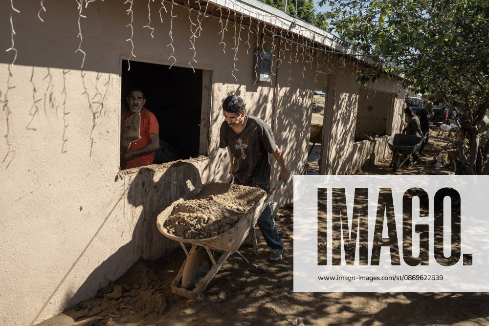 Tropical Storm Rachel leaves deadly flooding and damage in Ensen ENSENADA, MEXICO - OCTOBER 15: Residents of the Maneadero community clean mud and debris from their flooded homes following severe damage caused by Tropical Storm Rachel in Ensenada, Baja California, Mexico, on October 15, 2026. The storm damaged roadways and swept away vehicles across the region, claiming at least nine lives while search teams continue efforts to locate one missing person. Omar Martinez Anadolu Ensenada Mexico. Editorial use only. Please get in touch for any other usage.