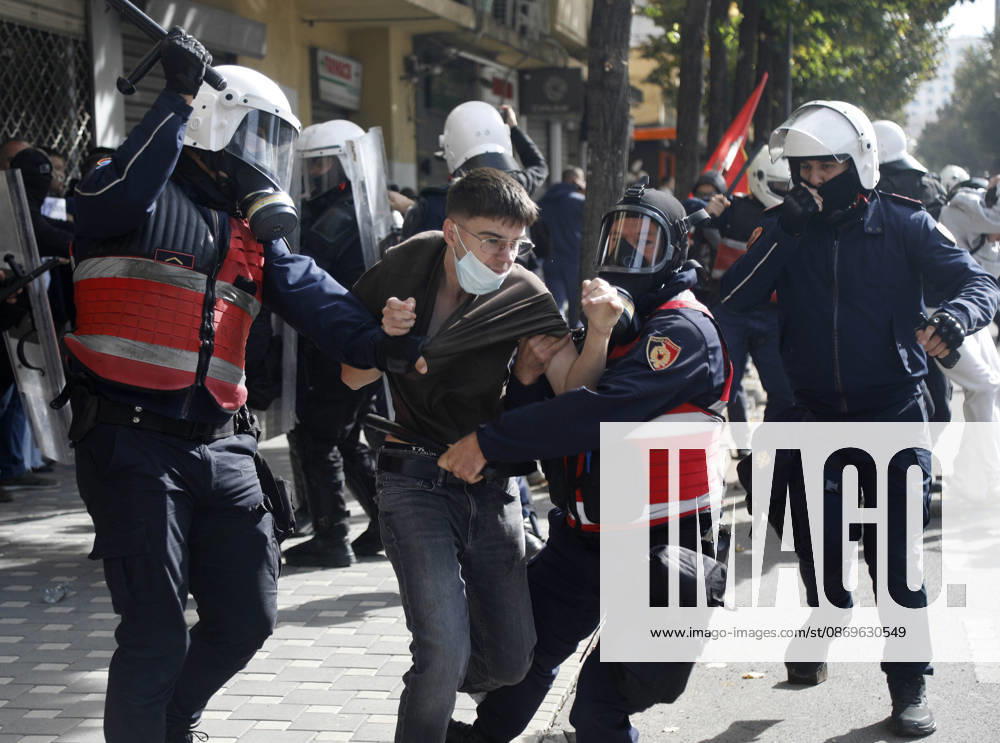 Protesters Clash with Police During a Demonstration in Tirana, Albania. Riot police detain a protester during an anti-government demonstration in central Tirana on October 15, 2026, as protests continued for a third consecutive day over university conditions and demands for the resignation of Albanian Prime Minister Edi Rama. The latest rally follows two nights of violence in the capital, during which protesters and riot police clashed, police used water cannons and tear gas, and demonstrators damaged government offices and shops and set fire to several buildings. Light Studio Agency Malton Dibra Tirana Albania