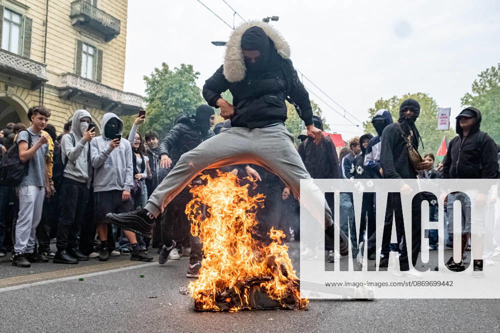Reportage - Student strike in Turin Some students jump over the fire set by the paper tank during Student strike in Turin, Reportage in Turin, Italy, October 16 2026 Turin City of Turin Italy