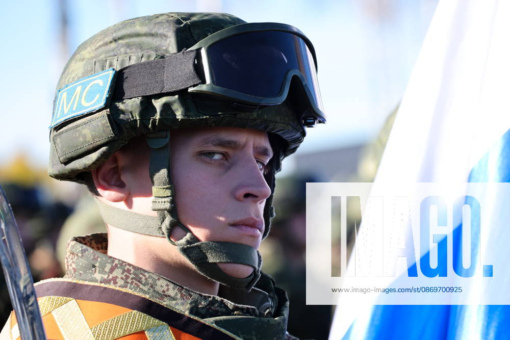 A serviceman appears with a national flag of Russia in the final live training phase of the Indestructible Brotherhood 2026 command-and-staff military exercise by the CSTO Peacekeeping Forces at the Losvido military training ground. Maxim Malinovsky TASS 99410887