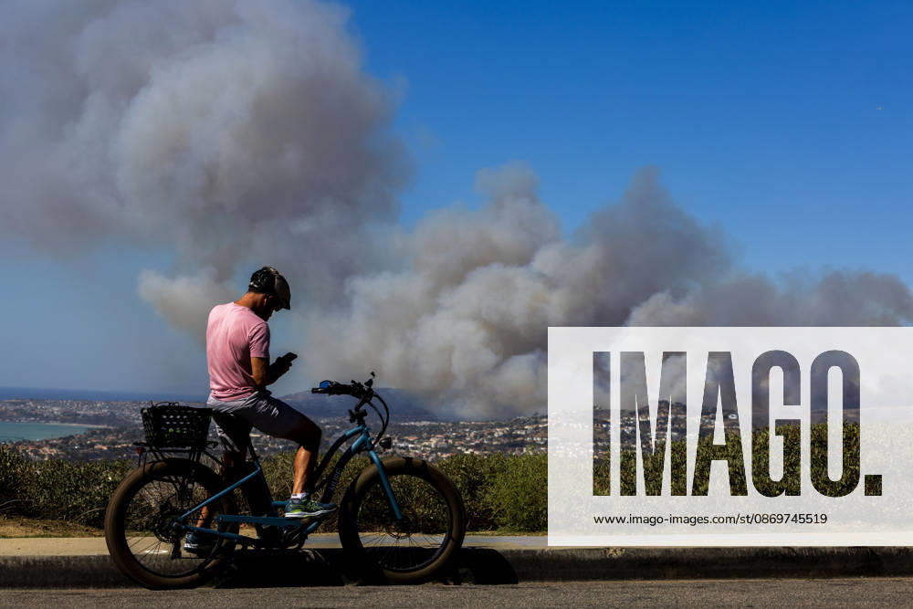 October16, 2026, San Juan Capistrano, California, USA: Fire crews are aggressively battling a wind-driven brush fire that burned several homes and threatened thousands of others in the area of San Juan Capistrano and San Clemente Friday, prompting evacuation orders. The Norte Fire exploded to 465 acres and remains 0 percent contained as of 4 p.m. O.C. Fire Authority officials said the Norte Fire started around 11:30 a.m. near Portico Del Norte and Eminencia Del Norte in San Clemente, east of Interstate 5. Fueled by strong Santa Ana winds, the wildfire then blew into neighboring San Juan Capistrano. San Juan Capistrano USA - ZUMAr19_ 20261016_new_r19_156