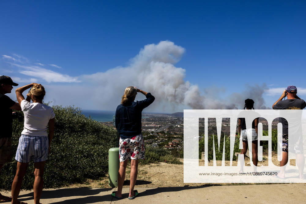 October16, 2026, San Juan Capistrano, California, USA: Fire crews are aggressively battling a wind-driven brush fire that burned several homes and threatened thousands of others in the area of San Juan Capistrano and San Clemente Friday, prompting evacuation orders. The Norte Fire exploded to 465 acres and remains 0 percent contained as of 4 p.m. O.C. Fire Authority officials said the Norte Fire started around 11:30 a.m. near Portico Del Norte and Eminencia Del Norte in San Clemente, east of Interstate 5. Fueled by strong Santa Ana winds, the wildfire then blew into neighboring San Juan Capistrano. San Juan Capistrano USA - ZUMAr19_ 20261016_new_r19_164