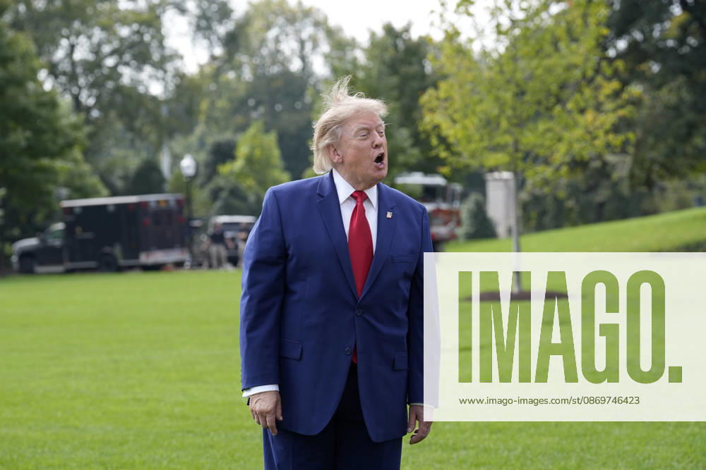 United States President Donald J Trump talks to the members of the media on the South Lawn of the White House in Washington, DC, USA, as he departs en route to Dalton, Georgia for a campaign rally on Friday