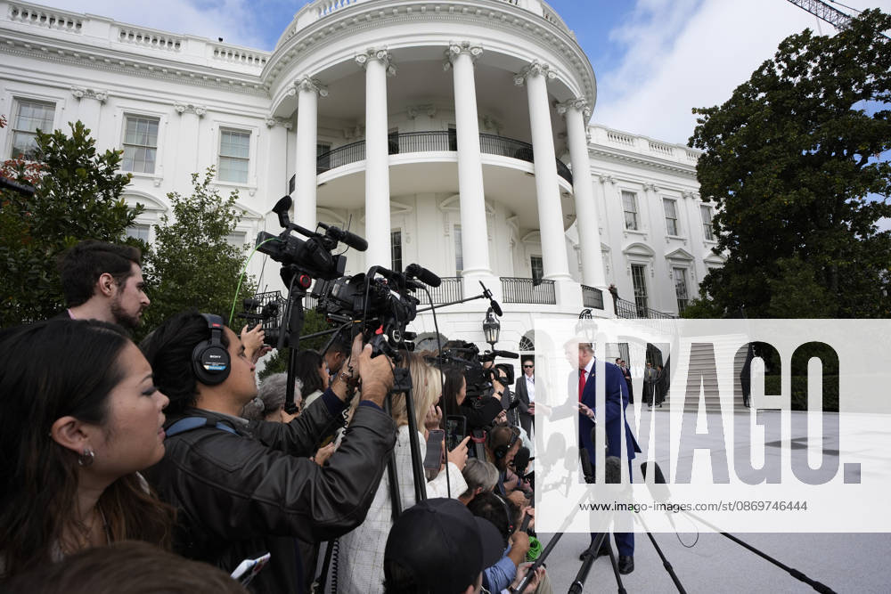 United States President Donald J Trump talks to the members of the media on the South Lawn of the White House in Washington, DC, USA, as he departs en route to Dalton, Georgia for a campaign rally on Friday