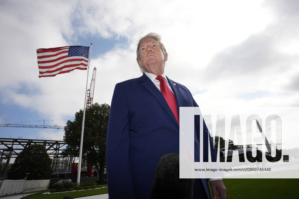 United States President Donald J Trump talks to the members of the media on the South Lawn of the White House in Washington, DC, USA, as he departs en route to Dalton, Georgia for a campaign rally on Friday