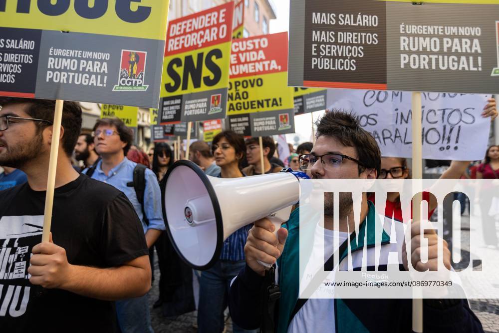 Protesters hold placards during the National CGTP demonstration. Thousands of people joined the National General Confederation of the Portuguese Workers – National Inter-Union (Confederação Geral dos Trabalhadores Portugueses – Intersindical Nacional) (CGTP) demonstration in Porto, marching from Praça da Batalha to Praça de D. João I, where they converged with participants of a housing rights protest. Porto Portugal - ZUMAs197 20261017_aaa_s197_295