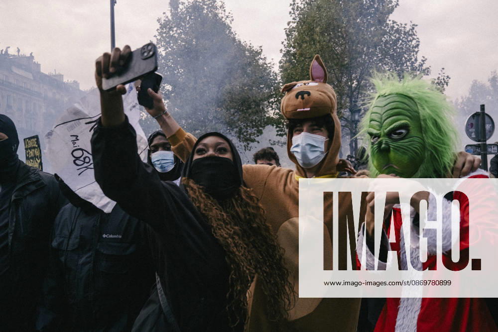 Paris Street Protest Costumed demonstrators pose for a photograph during a protest in Paris, France on October 16, 2026. Thousands of people gathered in Paris for a demonstration over purchasing power, living costs and broader economic concerns. Protesters marched through the city carrying banners, flags and handwritten placards while criticizing government policies and calling for measures to ease pressure on household budgets. Paris Ile de France France