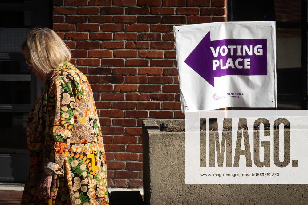 A woman walks past a sign directing people to a polling station in Vancouver, on Saturday Oct. 17, 2026. British Columbians are heading to the polls to cast their votes in municipal elections being held across the province. Port Moody CANADA - ZUMAc35_ 20261017_zaf_c35_014