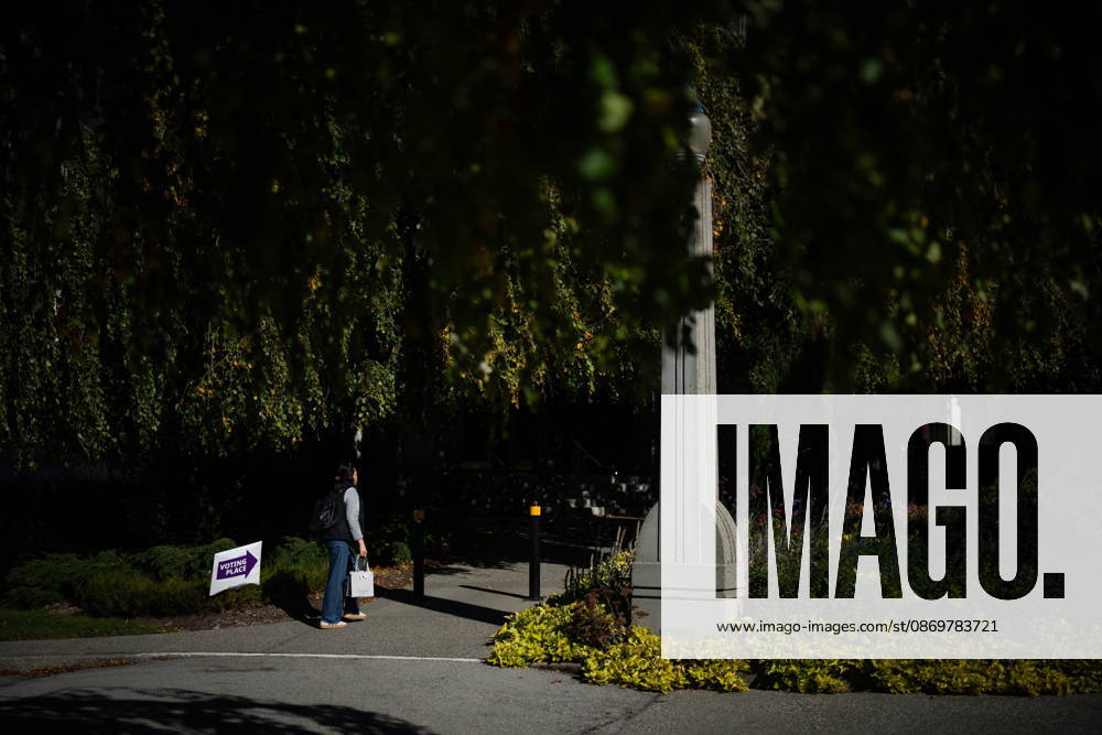 A woman walks past a sign directing people to a polling station in Vancouver, on Saturday Oct. 17, 2026. British Columbians are heading to the polls to cast their votes in municipal elections being held across the province. Port Moody CANADA - ZUMAc35_ 20261017_zaf_c35_018