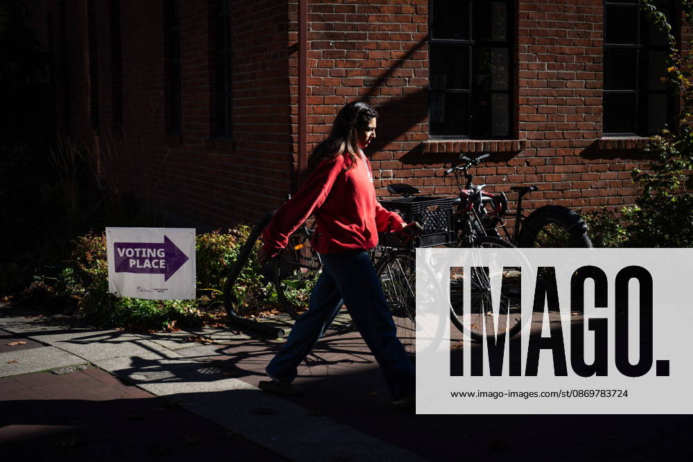 A woman walks past a sign directing people to a polling station in Vancouver, on Saturday Oct. 17, 2026. British Columbians are heading to the polls to cast their votes in municipal elections being held across the province. Port Moody CANADA - ZUMAc35_ 20261017_zaf_c35_021