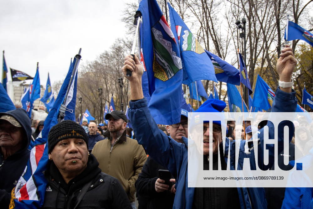 Attendees wave flags during an Alberta independence rally at the Alberta legislature, in Edmonton on Saturday, Oct. 17, 2026. Edmonton Canada - ZUMAc35_ 20261017_zaf_c35_031