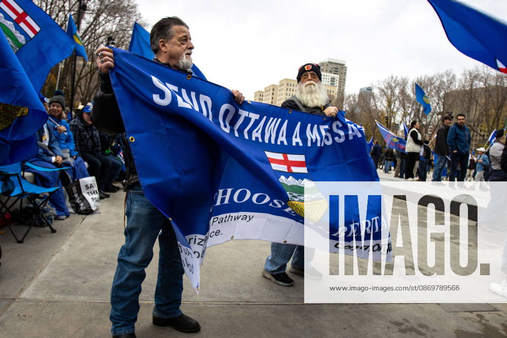 Attendees hold a banner during an Alberta independence rally just ahead of the Oct. 19 referendum at the Alberta legislature, in Edmonton on Saturday, Oct. 17, 2026. Edmonton Canada - ZUMAc35_ 20261017_zaf_c35_034