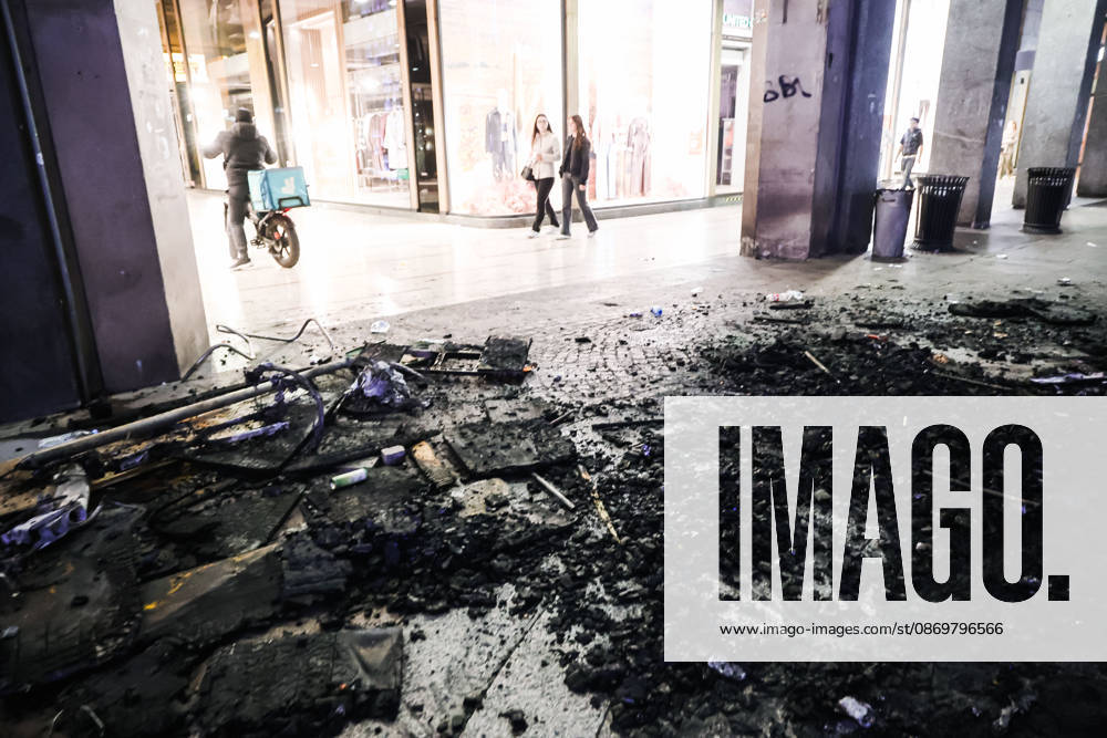 IPA89830542 - Milan: Damage caused by clashes between protesters and police during the Italia in Piazza demonstration against the high cost of living in the city center. Pictured: Damage on Corso Vittorio Emanuele II