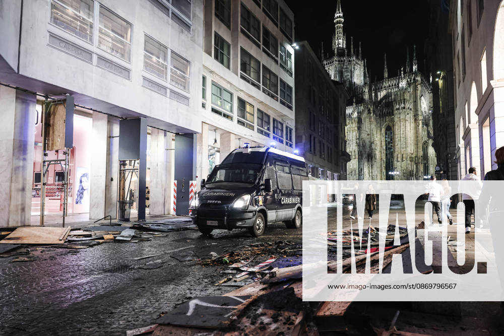 IPA89830543 - Milan: Damage caused by clashes between protesters and police during the Italia in Piazza demonstration against the high cost of living in the city center. Pictured: Police and Carabinieri on Corso Vittorio Emanuele II