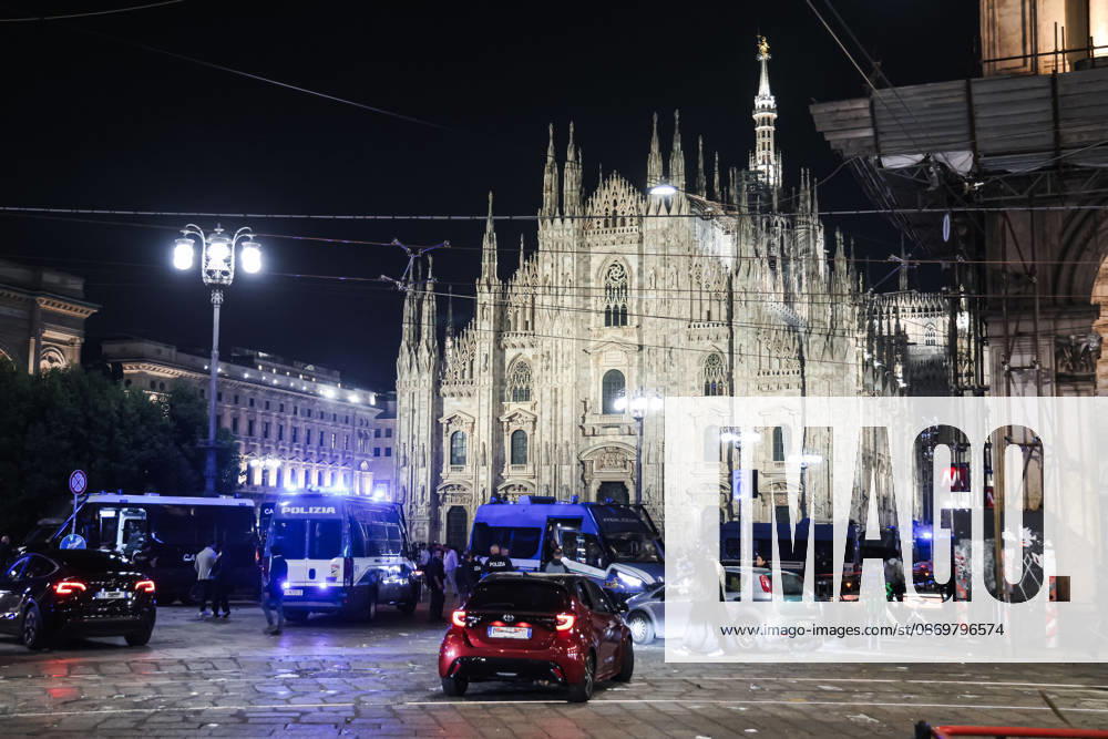 IPA89830554 - Milan: Damage caused by clashes between protesters and police during the Italia in Piazza demonstration against the high cost of living in the city center. Pictured: Police in Piazza del Duomo