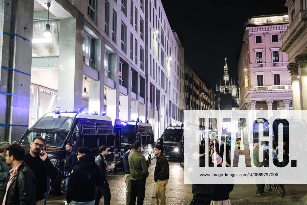 IPA89830539 - Milan: Damage caused by clashes between protesters and police during the Italia in Piazza demonstration against the high cost of living in the city center. Pictured: Police and Carabinieri on Corso Vittorio Emanuele II