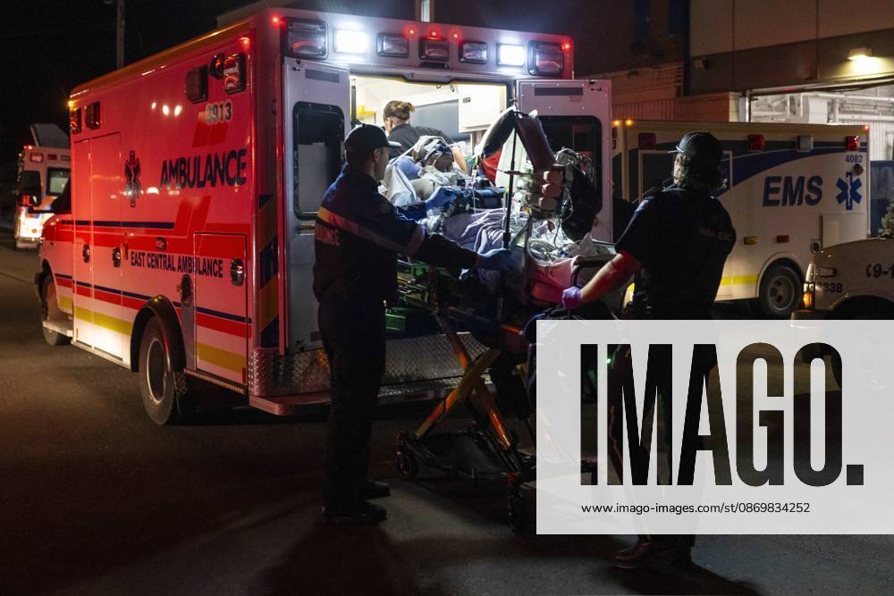 Paramedics load an injured person into an ambulance at the Wainwright Health Centre as injured military members are treated after a fire at CFB Wainwright, outside of Wainwright, Alta., on Saturday, Oct. 17, 2026. Wainwright Canada - ZUMAc35_ 20261017_zaf_c35_156