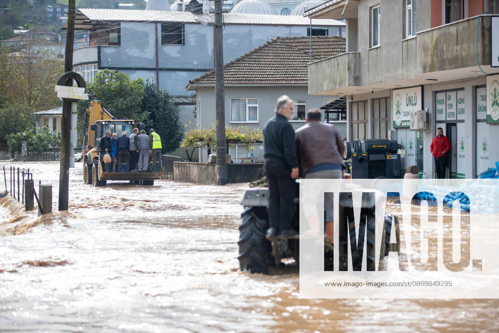Heavy rainfall causes flooding in Sakarya, Turkiye SAKARYA, TURKIYE - OCTOBER 18: Residents are transported on a tractor and in the bucket of a backhoe loader through a flooded street in the Daricayiri neighborhood of Karasu district in Sakarya, Turkiye, on October 18, 2026. Heavy rainfall overnight causes a stream to overflow, inundating streets and residential areas. Ibrahim Yozoglu Anadolu Sakarya Turkey. Editorial use only. Please get in touch for any other usage.