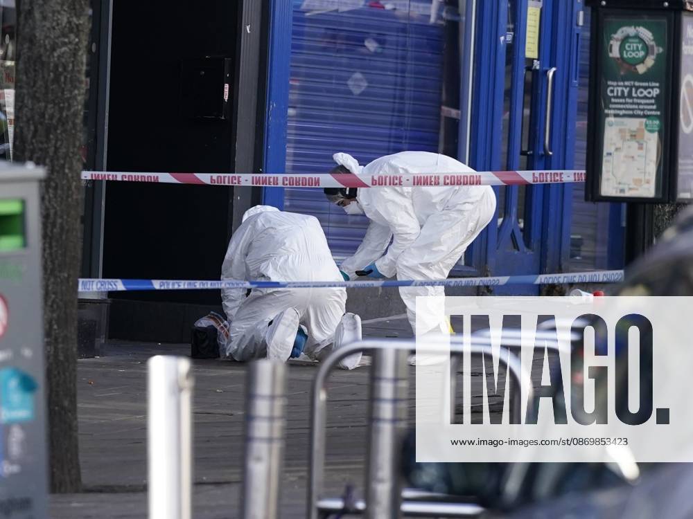 Forensic investigators examine scene after police officer shot in Nottingham NOTTINGHAM, UNITED KINGDOM - OCTOBER 18: Forensic investigators in protective suits examine a cordoned-off crime scene as police officers secure the area after a police office was shot early in the morning on October 18, 2026, in Nottingham, United Kingdom. The scene remains cordoned off following a reported shooting involving a police officer earlier in the morning. A police officer was shot after approaching two people earlier in the morning and was taken to hospital for treatment, according to Nottinghamshire Police. Giannis Alexopoulos Anadolu Nottingham United Kingdom. Editorial use only. Please get in touch for any other usage.