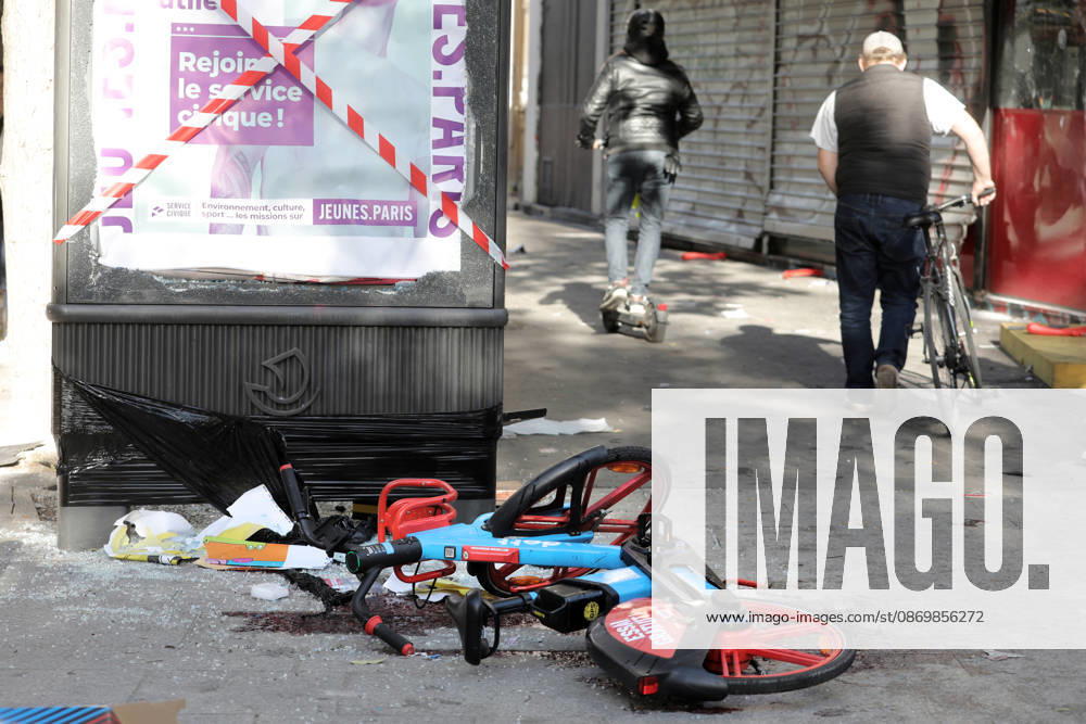 People walk past debris near Republique Square in Paris, on Sunday, October 18, 2026. Residents awoke to scenes of widespread damage with shopfronts shattered, burnt out cars, charred bikes, and piles of glass and debris on the pavements of the French capital a day after riots erupted during protests against rising fuel prices, the cost of living and deteriorating public services, including schools. PAR20261018107 MAYAxVIDON-WHITE