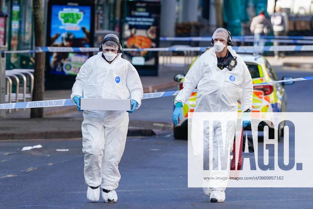 Forensic investigators examine scene after police officer shot in Nottingham NOTTINGHAM, UNITED KINGDOM - OCTOBER 18: Forensic investigators in protective suits examine a cordoned-off crime scene as police officers secure the area after a police office was shot early in the morning on October 18, 2026, in Nottingham, United Kingdom. The scene remains cordoned off following a reported shooting involving a police officer earlier in the morning. A police officer was shot after approaching two people earlier in the morning and was taken to hospital for treatment, according to Nottinghamshire Police. Loannis Alexopoulos Anadolu Nottingham United Kingdom. Editorial use only. Please get in touch for any other usage.