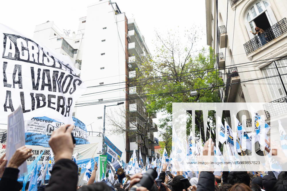 Former President Cristina Ferno¡ndez de Kirchner greets her supporters from the balcony of her home, where she is serving house arrest. Buenos Aires Argentina - ZUMAp265 20261018_zip_p265_007