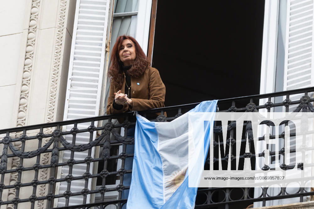 Former President Cristina Ferno¡ndez de Kirchner greets her supporters from the balcony of her home, where she is serving house arrest. Buenos Aires Argentina - ZUMAp265 20261018_zip_p265_009