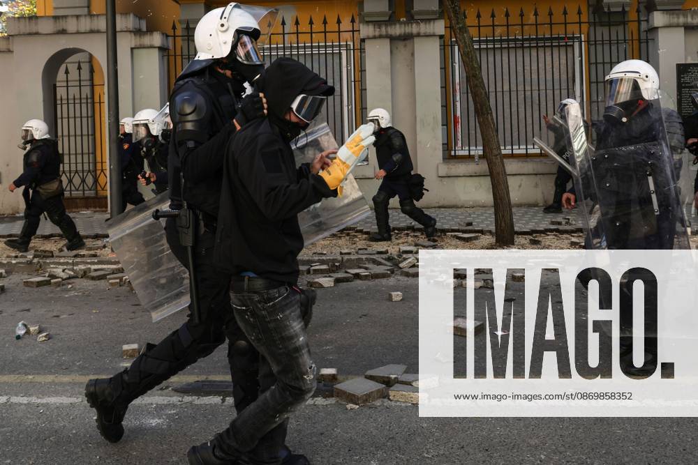 TIRANA, ALBANIA, OCTOBER 18, 2026: Demonstrators clash with riot police outside the Ministry of Education in Tirana as student-led anti-government protests continue for a sixth consecutive day. Protesters throw stones while police respond with tear gas, water cannons and rubber bullets. The demonstrations demand improved university conditions and the resignation of Prime Minister Edi Rama. Tirana Albania - ZUMAq101 20261018_zna_q101_069