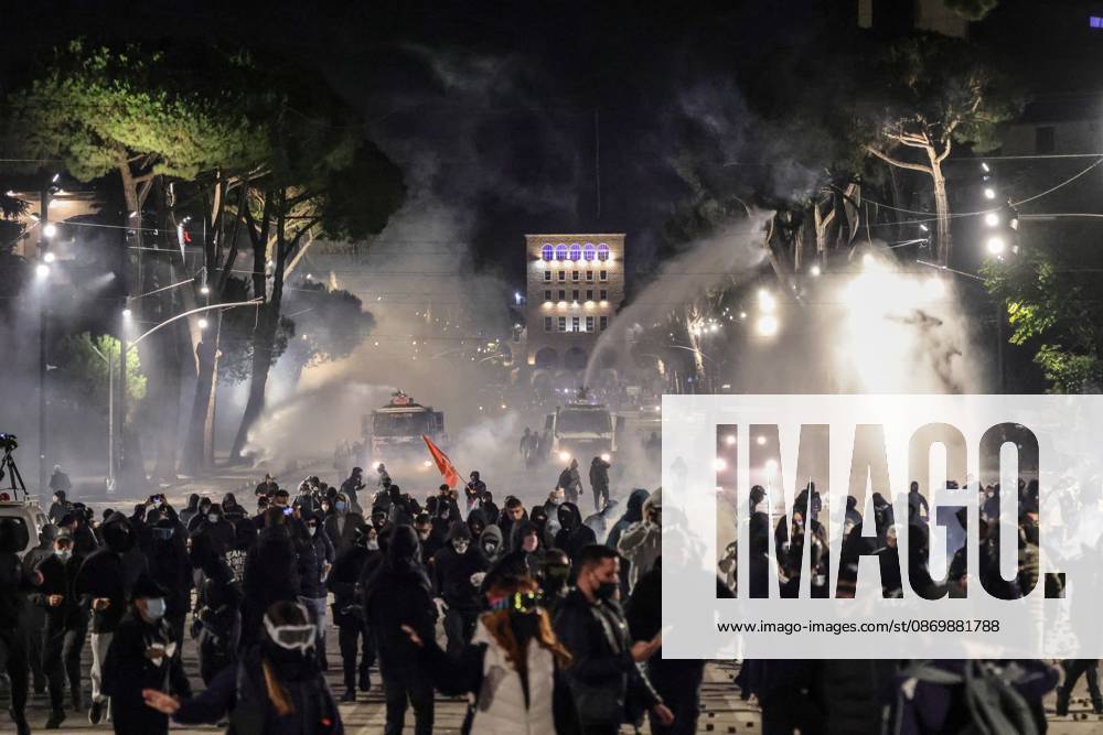 TIRANA, ALBANIA, OCTOBER 18, 2026: Demonstrators clash with riot police in Skanderbeg Square as student-led anti-government protests continue for a sixth consecutive day. Confrontations spread from the Ministry of Education to central Tirana, with protesters throwing stones and pyrotechnics while police deploy tear gas and water cannons. Demonstrators demand improved university conditions and the resignation of Prime Minister Edi Rama. Tirana Albania - ZUMAq101 20261018_zna_q101_222