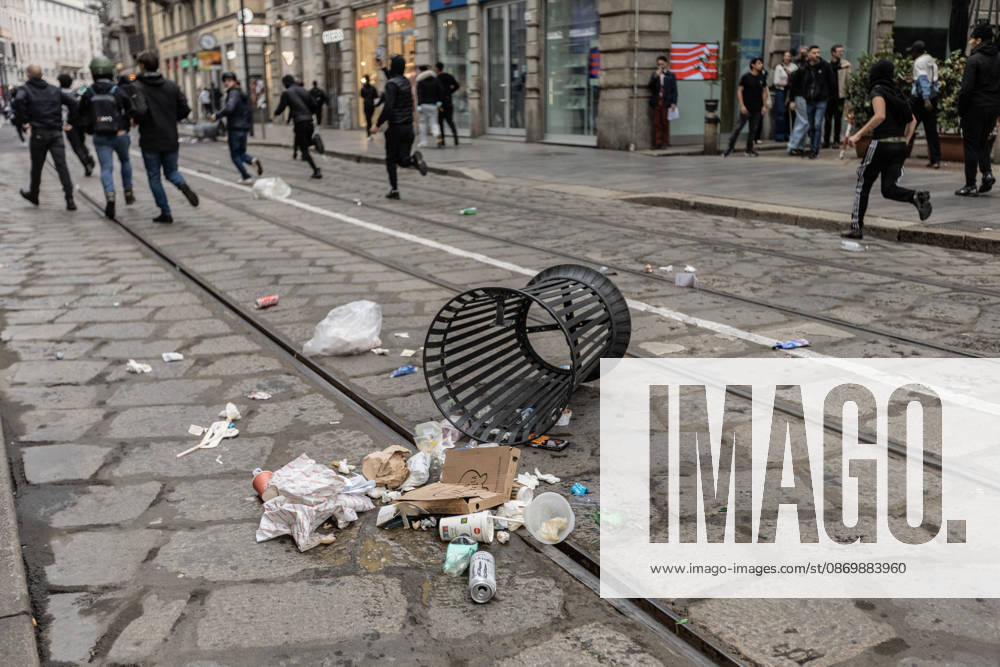 Police detain 160 as unrest continues for second day in Milan MILAN, ITALY - OCTOBER 18: An overturned trash bin is seen on a street following protests in Milan, Italy, on October 18, 2026. Groups threw stones, bottles, firecrackers and barriers at police officers, who responded with tear gas and water cannon, while shops were damaged and looted around the city center and a Carabinieri vehicle was destroyed. Andrea Carrubba Anadolu Milan Italy. Editorial use only. Please get in touch for any other usage.