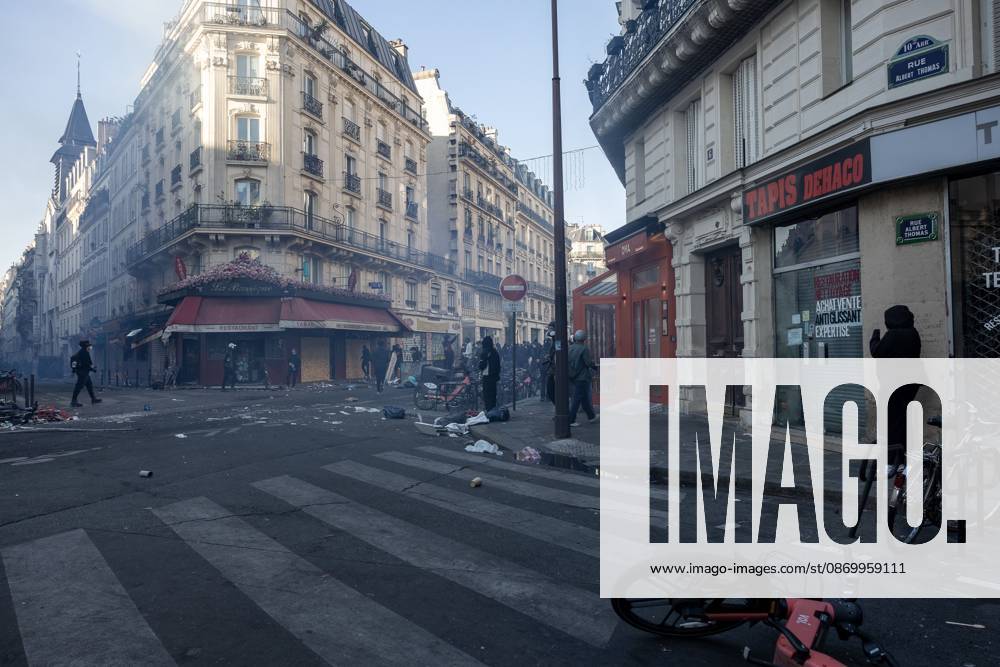 PARIS, FRANCE - OCTOBER 18, 2026: Protesters clash with police near Place de la RÃ publique in Paris during a protest against austerity. Protesters set up makeshift barricades and start fires in the square and surrounding streets. After police clear the square, protesters attack nearby shops. Paris France - ZUMAq101 20261018_zna_q101_289