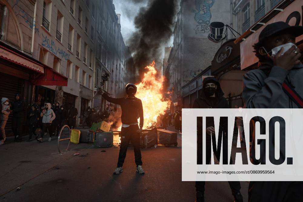 PARIS, FRANCE - OCTOBER 18, 2026: Protesters clash with police near Place de la RÃ publique in Paris during a protest against austerity. Protesters set up makeshift barricades and start fires in the square and surrounding streets. After police clear the square, protesters attack nearby shops. Paris France - ZUMAq101 20261018_zna_q101_298