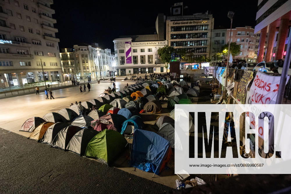 Rows of tents occupy Praca D. Joao I during the ongoing housing protest camp. Activists remained in the square for another night while awaiting a possible police intervention to remove the encampment as the authorized protest approached its final days. Porto Portugal - ZUMAs197 20261019_aaa_s197_100