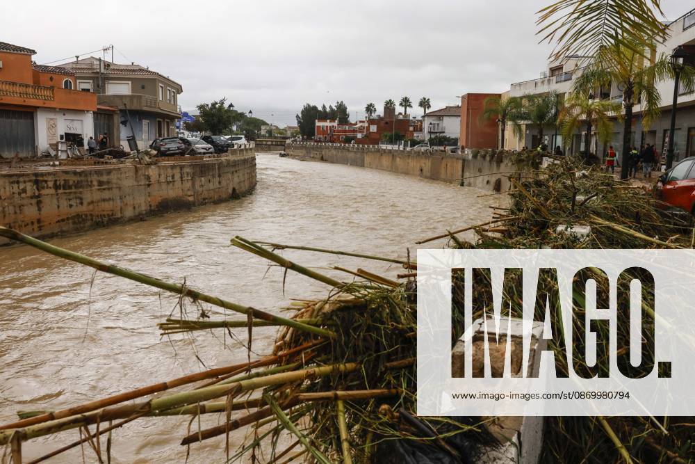 The Valencian Regional Government is preparing a lockdown order for the southern coast of Valencia and the northern coast of Alicante due to the rains. The river is filled with mud and vegetation carried by the rainwater, as of October 19, 2026, in Els Poblets, Valencian Community, Spain. The Valencian Regional Government is preparing a lockdown order for the southern coast of Valencia and the northern coast of Alicante in response to the emergency declared due to the rains caused by Storm Adam, as announced by the Regional Minister of Emergencies and the Interior early this morning, October 19, from the Emergency Coordination Center (CCE) October 19, 2026, Valencia, Valencian Community, Spain