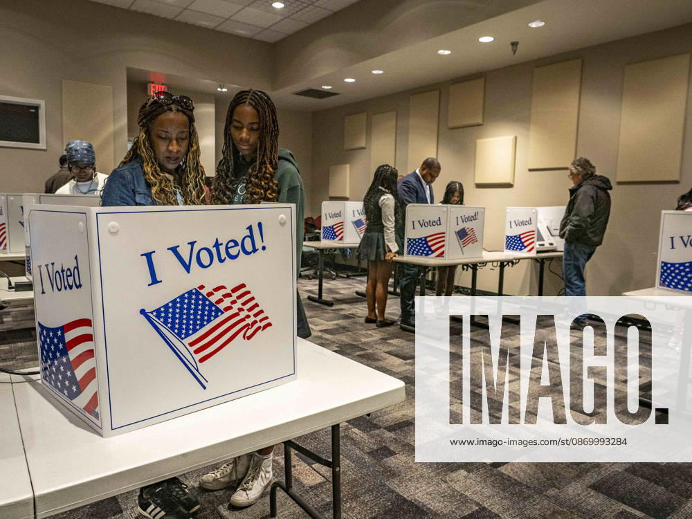 JERRILYN JONES, wife of Democratic Congressional candidate CHRIS JONES, explains how to vote to their eldest daughter, JORDYN JONES. Across the room, CHRIS JONES explains the same to his younger daughters, JANELLE and JASMINE JONES. They are casting their votes on the first day of early vote in Arkansas. Jones is running for the seat now held by Rep. French Hill (R-AR). Should Jones win, he will be the first Black person Arkansas sends to Congress. Little Rock USA - ZUMAd155 20261019_znp_d155_032