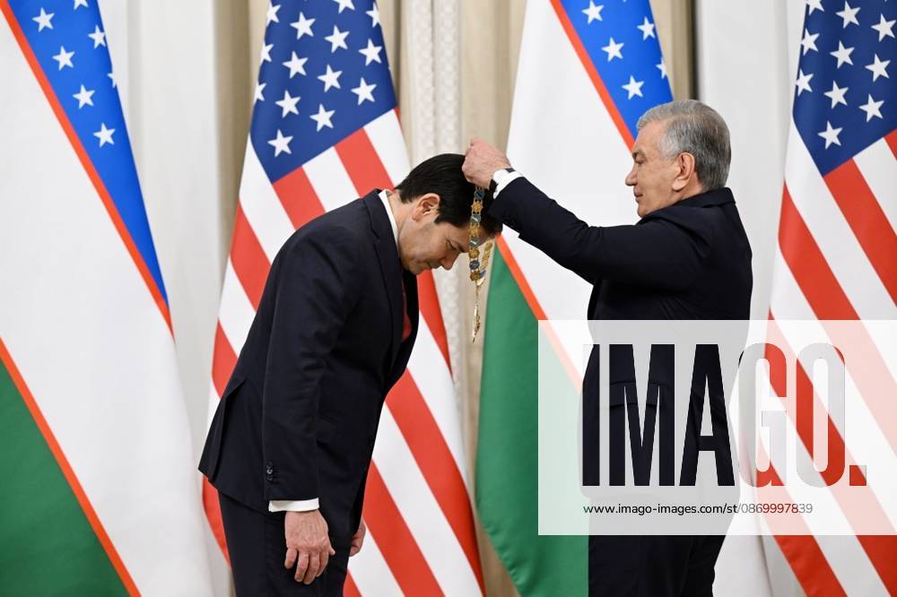 US Secretary of State Marco Rubio in Uzbekistan SAMARKAND, UZBEKISTAN - OCTOBER 19 : (---- - MANDATORY CREDIT - UZBEKISTAN PRESIDENCY HANDOUT - NO MARKETING NO ADVERTISING CAMPAIGNS - DISTRIBUTED AS A SERVICE TO CLIENTS----) Uzbek President Shavkat Mirziyoyev (R) presents the Order For Great Services to US Secretary of State Marco Rubio (L) who arrived to attend the C5+1 Central Asia-US Foreign Ministers Meeting and the second meeting of the Uzbekistan-US Business and Investment Council in Samarkand, Uzbekistan on October 19, 2026. Uzbekistan Presidency Anadolu Samarkand Uzbekistan. Editorial use only. Please get in touch for any other usage.
