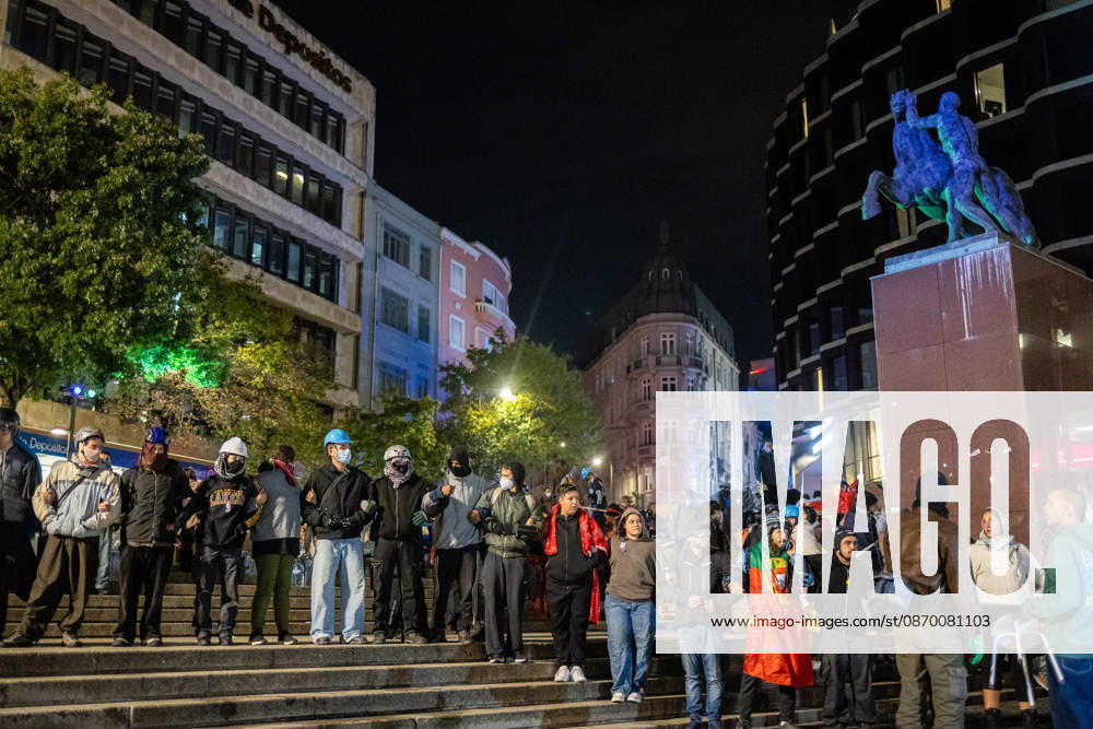 Protesters form a human chain facing police officers during the clearance of the housing protest camp at Praca D. Joao I. The operation proceeded without major incidents or reports of violence. Porto Portugal - ZUMAs197 20261020_aaa_s197_036