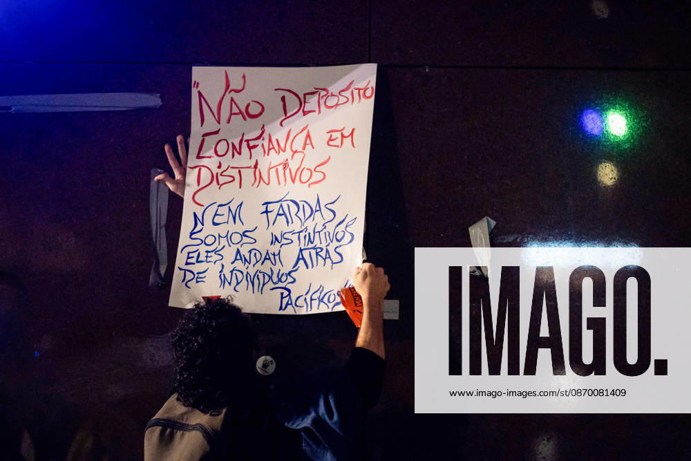 A protester seen holding a handwritten placard during the police operation to dismantle the housing protest camp at Praca D. Joao I. Porto Portugal - ZUMAs197 20261020_aaa_s197_051
