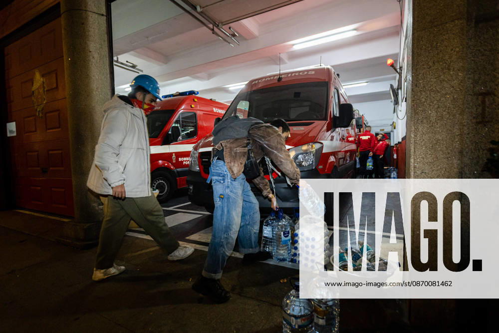 Protesters store water supplies at a fire station near Praca D. Joao I during the clearance of the housing protest camp. Activists removed materials and belongings from the encampment as the occupation came to an end. Porto Portugal - ZUMAs197 20261020_aaa_s197_052