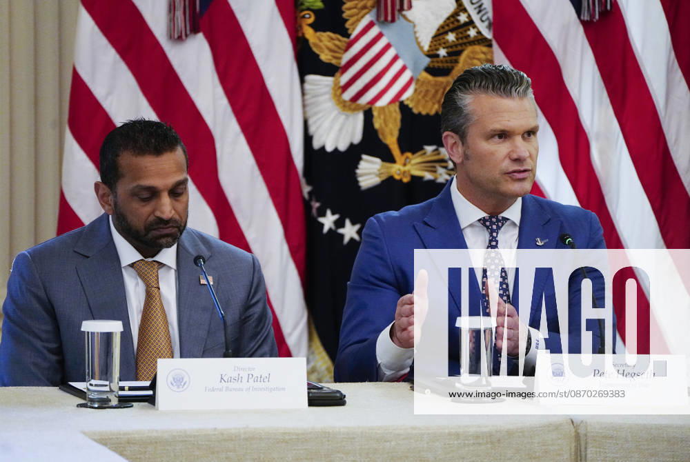 Defense Secretary ?Pete Hegseth speaks as FBI Director Kash Patel (L) listens during a roundtable discussion on cybercrime in the East Room of the White House in Washington, DC on Wednesday, October 21, 2026. The discussion focuses on combatting foreign-based organized crime targeting Americans online and federal seizures of fraudulent crypto and scam websites. WAP20261021915 BONNIExCASH