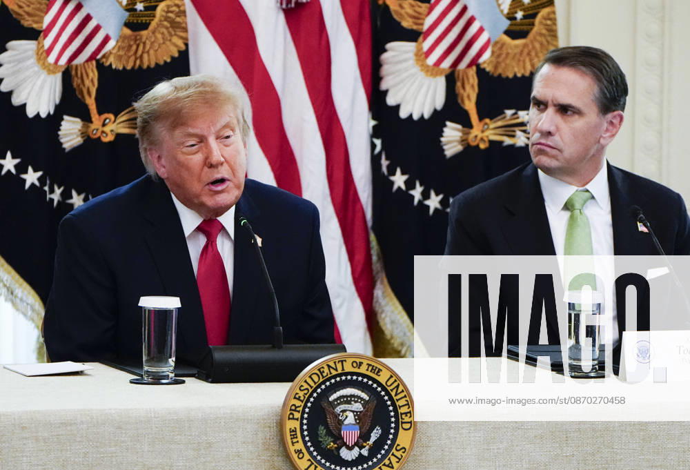 President Donald Trump speaks as Attorney General Todd Blanche (R) listens during a roundtable discussion on cybercrime in the East Room of the White House in Washington, DC on Wednesday, October 21, 2026. The discussion focuses on combatting foreign-based organized crime targeting Americans online and federal seizures of fraudulent crypto and scam websites. WAP20261021924 BONNIExCASH
