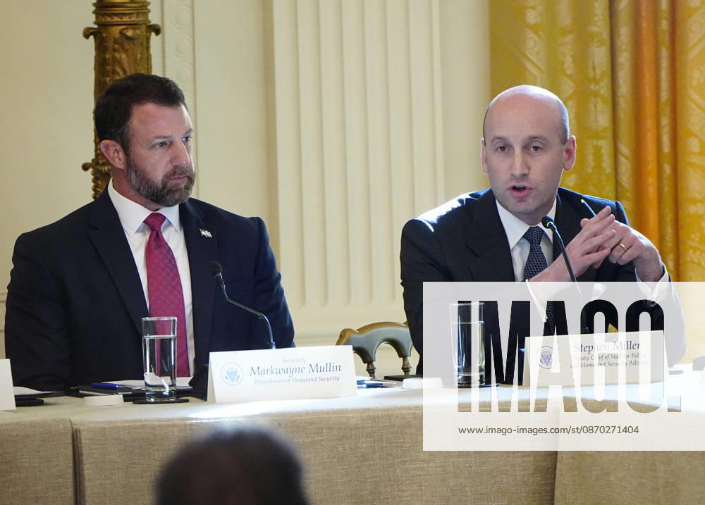 Deputy Chief of Staff Stephen Miller ??speaks as Homeland Security Secretary Markwayne Mullin (L) listens during a roundtable discussion on cybercrime in the East Room of the White House in Washington, DC on Wednesday, October 21, 2026. The discussion focuses on combatting foreign-based organized crime targeting Americans online and federal seizures of fraudulent crypto and scam websites. WAP20261021920 BONNIExCASH