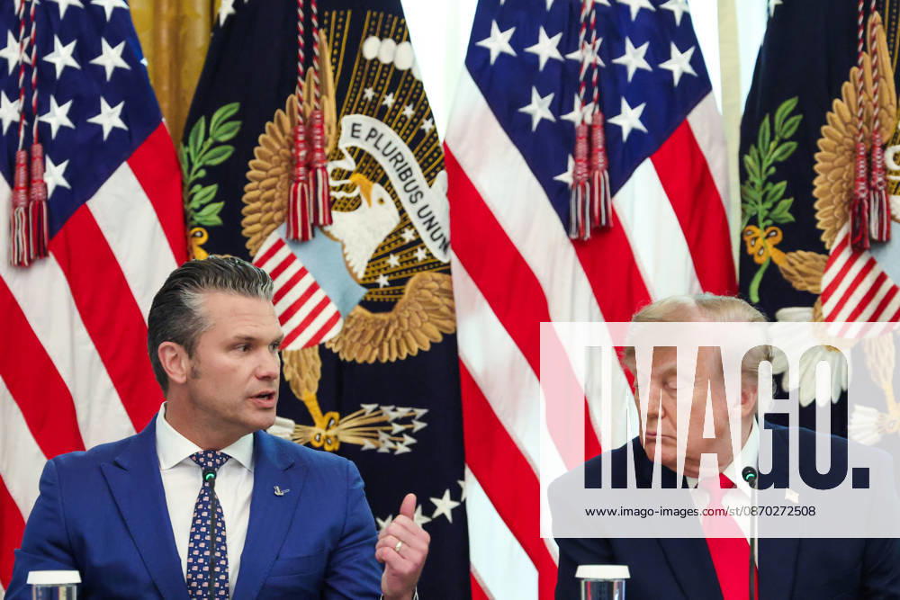 Defense Secretary â Pete Hegseth speaks as President Donald Trump listens speaks during a roundtable discussion on cybercrime in the East Room of the White House in Washington DC on Wednesday, October 21, 2026. WAX20261021912 SamuelxCorum