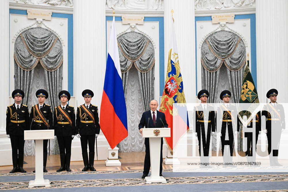 RUSSIA, MOSCOW - OCTOBER 22, 2026: Russia s President Vladimir Putin (C) speaks during a ceremony to present the banner of the Federal Customs Service of Russia to the agency s head Pikalev (not pictured). Approved by a presidential decree in 2019, the banner has not yet been presented to the agency s top official. Pelageya Tikhonova POOL TASS 99763322